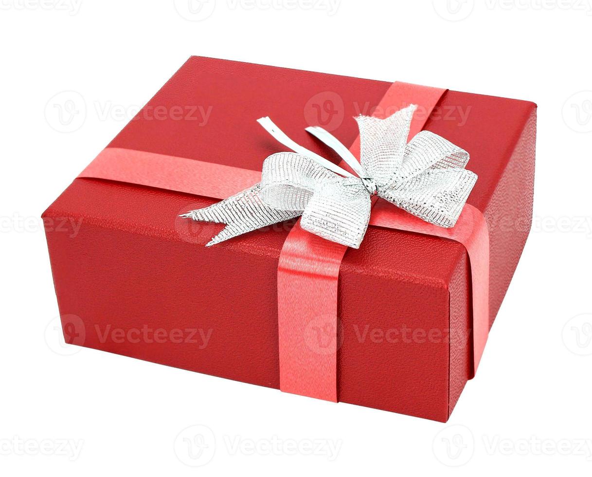 Red gift box with ribbon bow isolated on white background photo