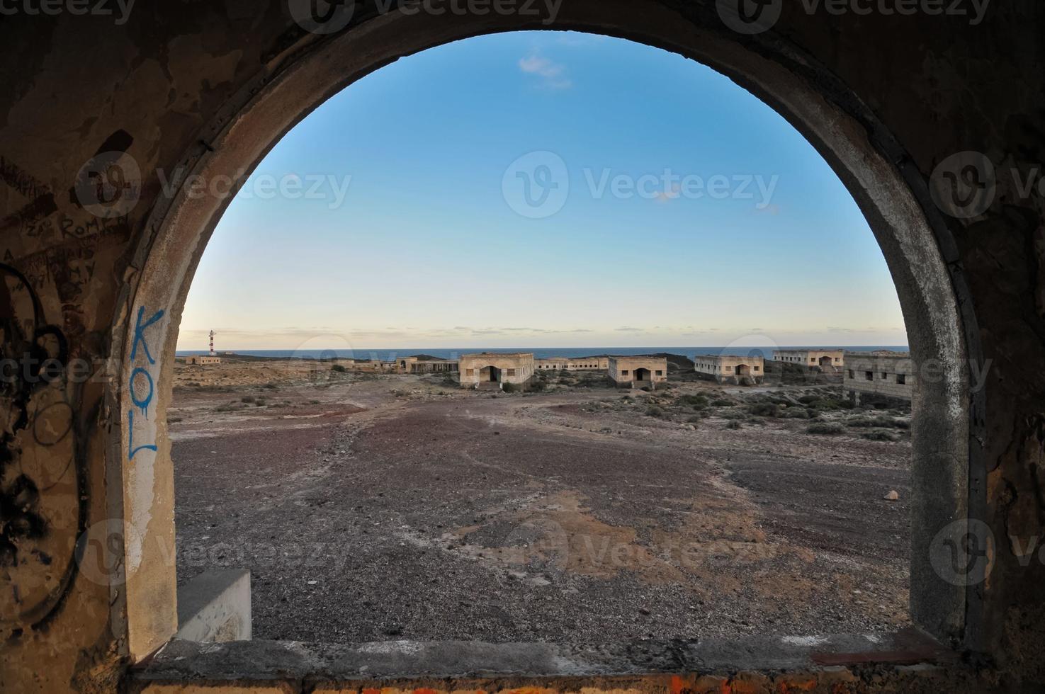 Abandoned buildings in the desert photo