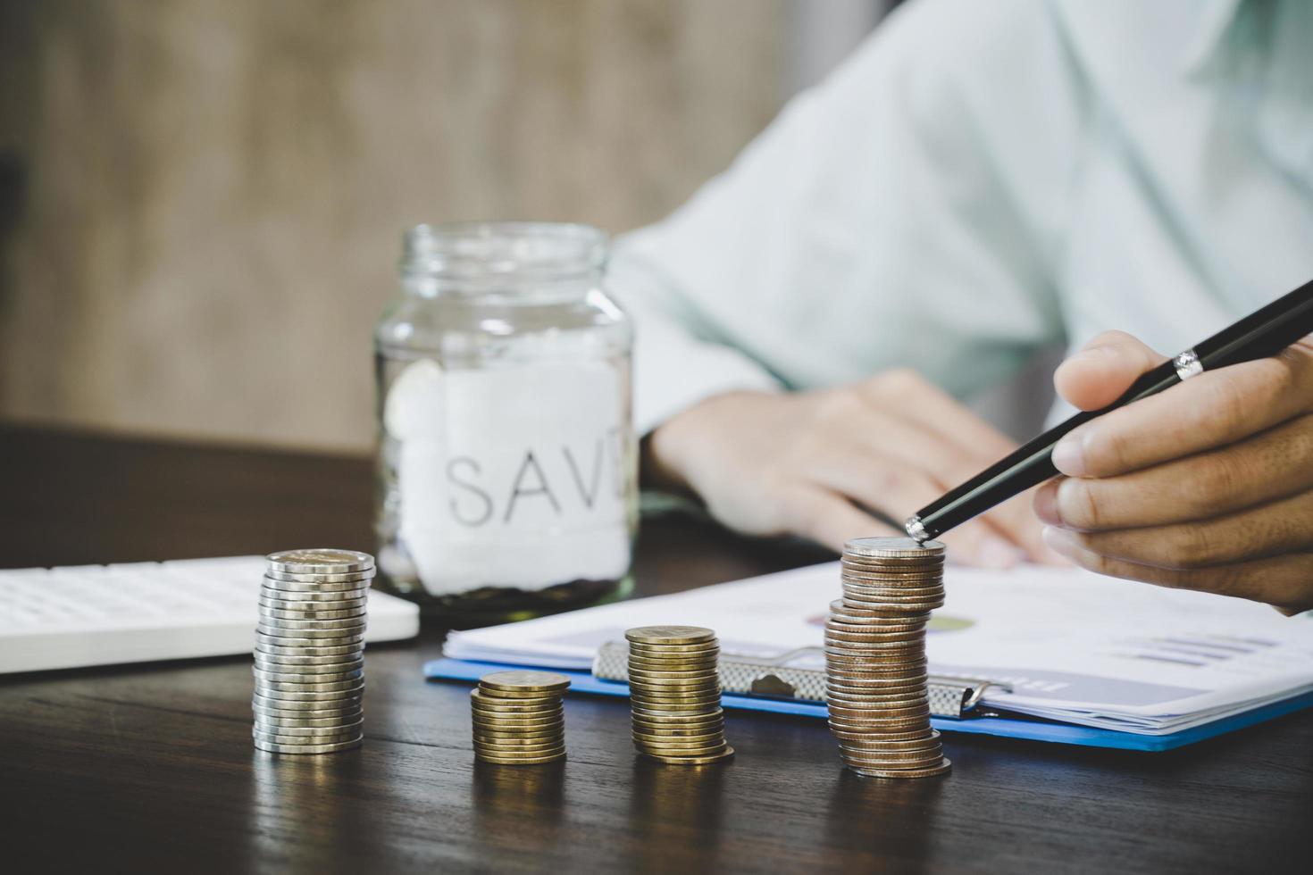 Female hand with money coin stack photo