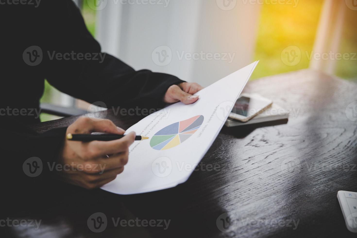 Businessman looking at charts photo