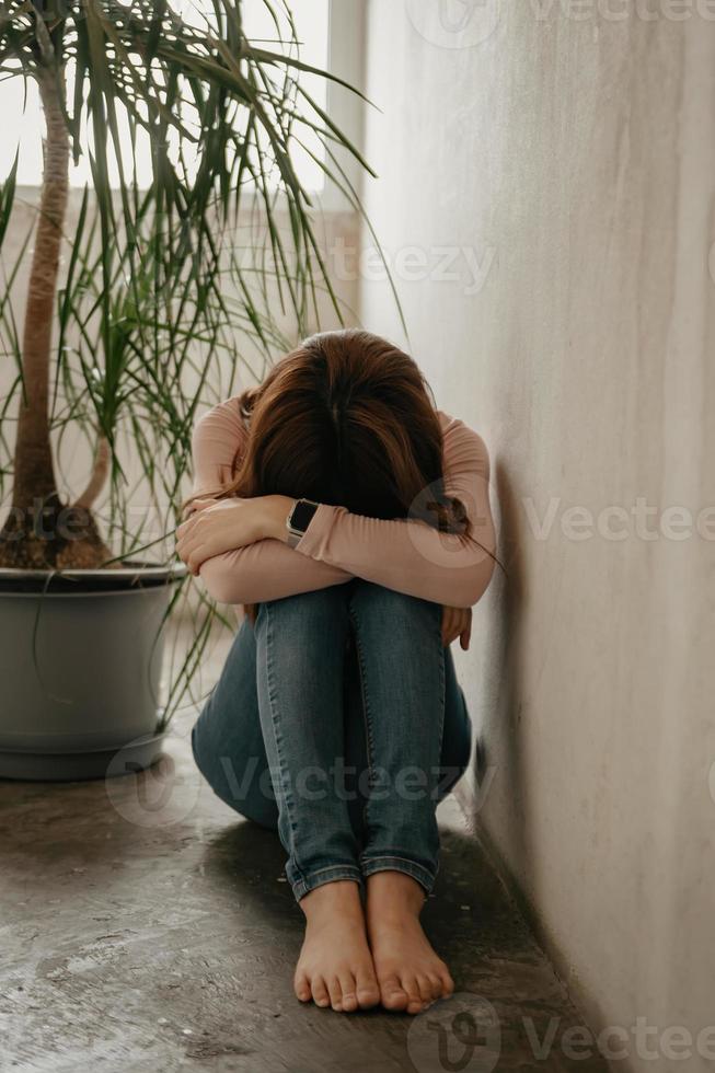 woman sit Depression Standing by window and anxiety Copy space. photo