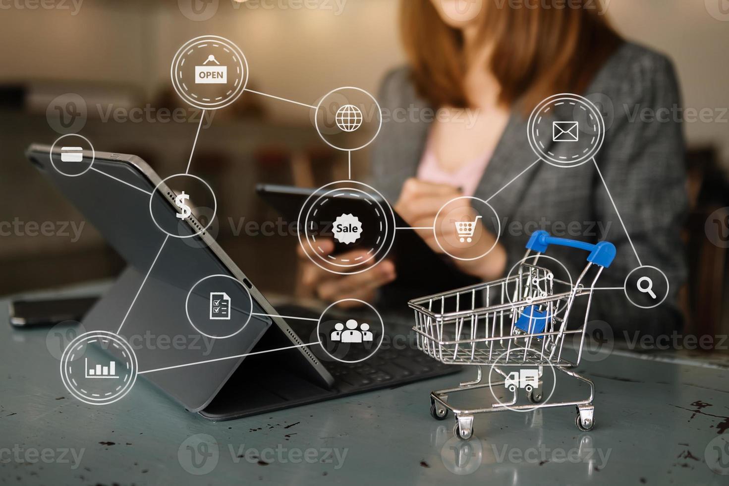 Cart Online Shopping concept. businesswoman hand using smart phone, tablet payments online shopping, omni channel, computer virtual icons photo
