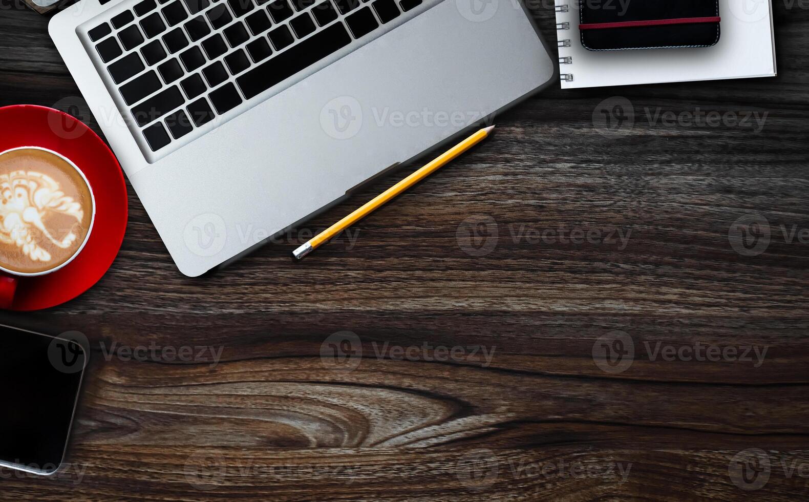 Top view of office desktop with various supplies and devices. Workplace concept photo