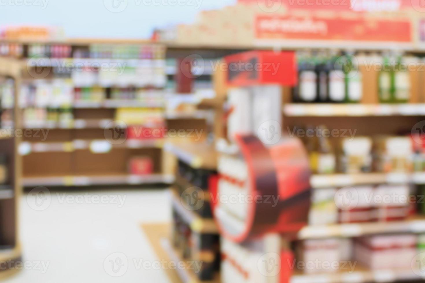 wine shelves in supermarket blurred background photo