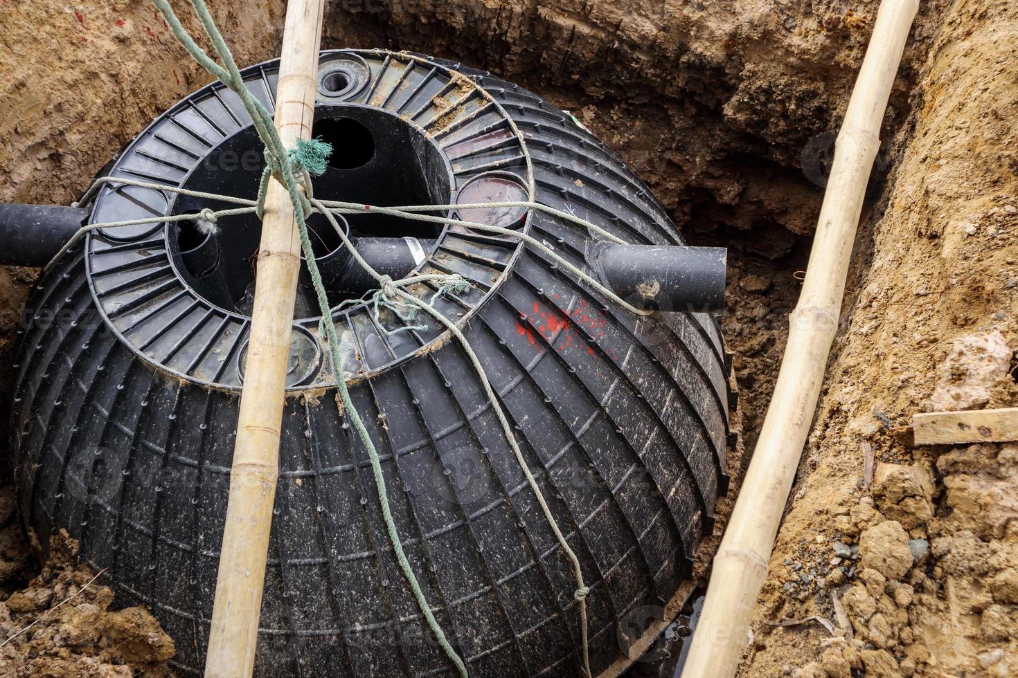 septic tank installation into the ground photo