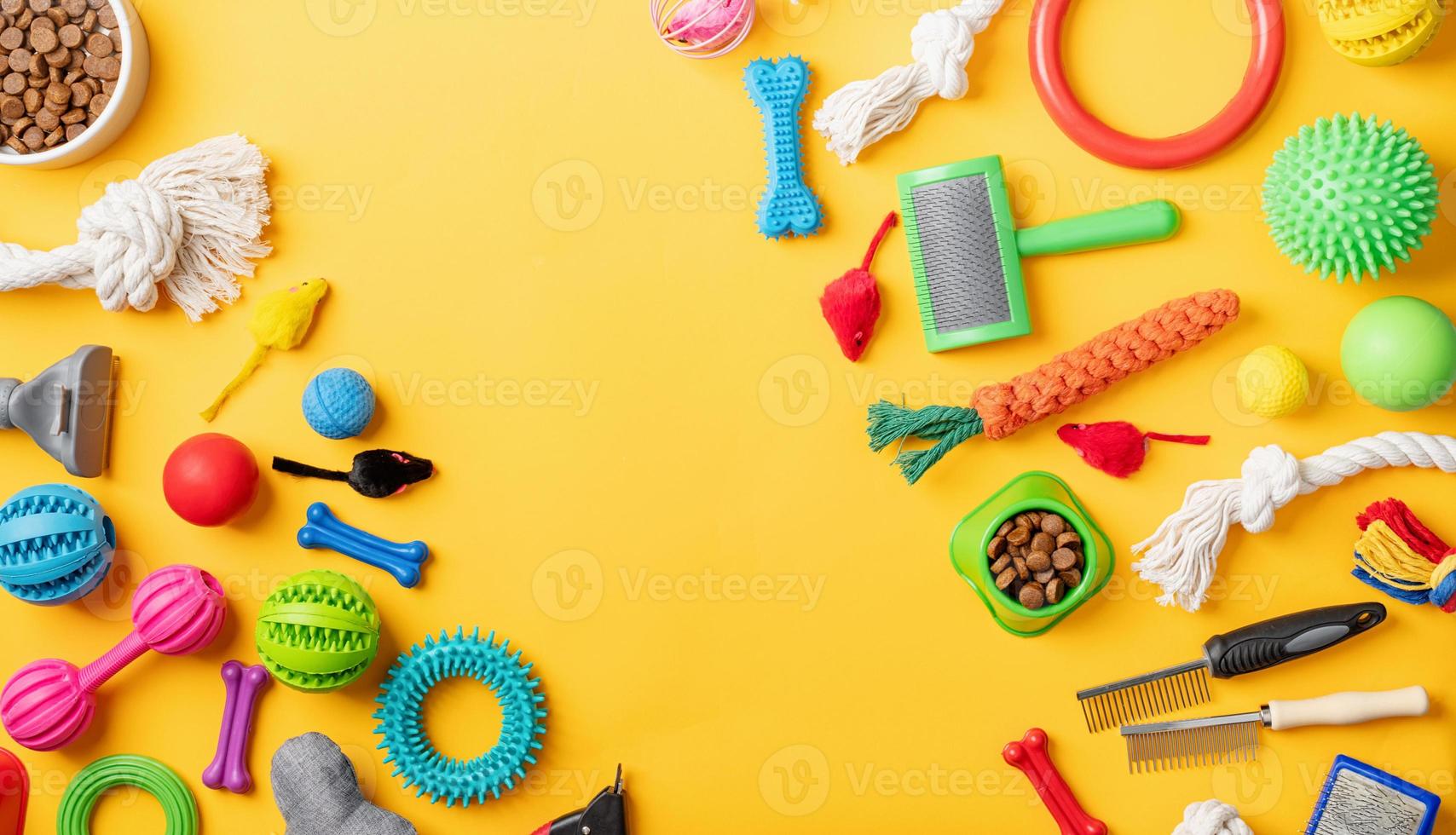 Pet care concept, various pet accessories and tools on yellow background, flat lay photo