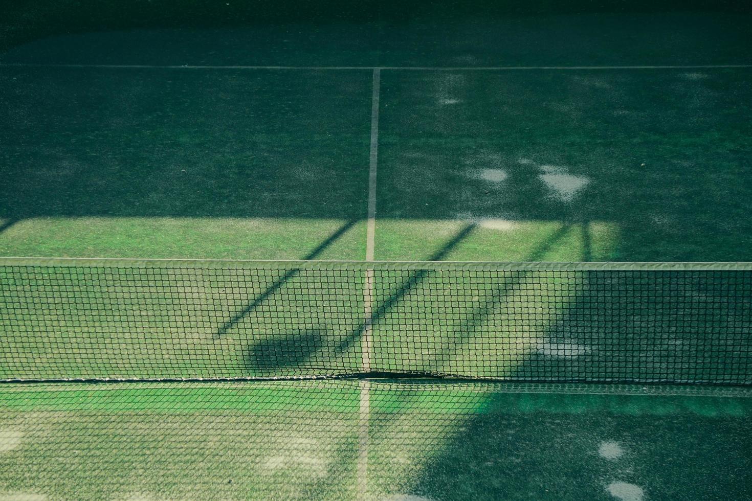 empty tennis court in the sports center photo