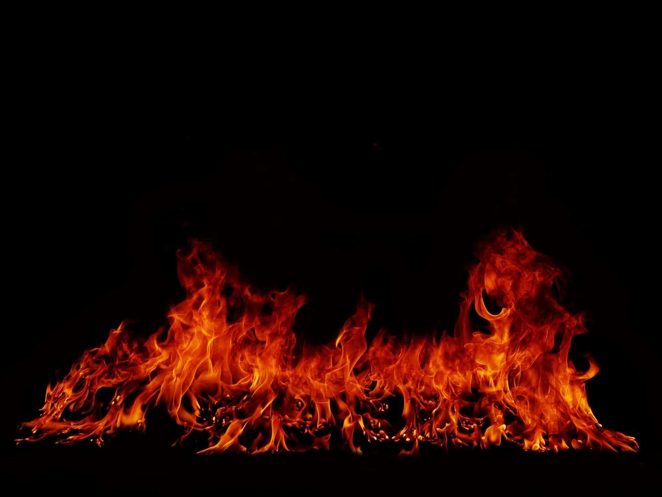 Flame Flame Texture For Strange Shape Fire Background Flame meat that is burned from the stove or from cooking. danger feeling abstract black background Suitable for banners or advertisements. photo