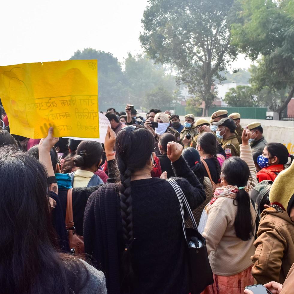 New Delhi, India December 25 2021 - Delhi Contractual Guest Teachers with posters, flags and graffiti protesting against Delhi AAP Government for making policy, Delhi Guest Teachers protesting photo