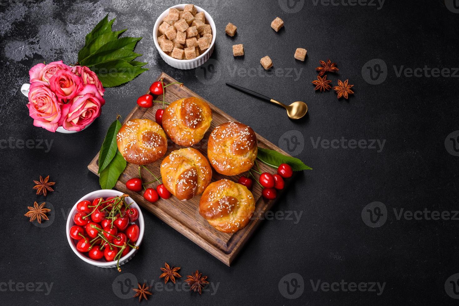 Fresh delicious rice flour muffins with cherries on a concrete background. Homemade pastries photo