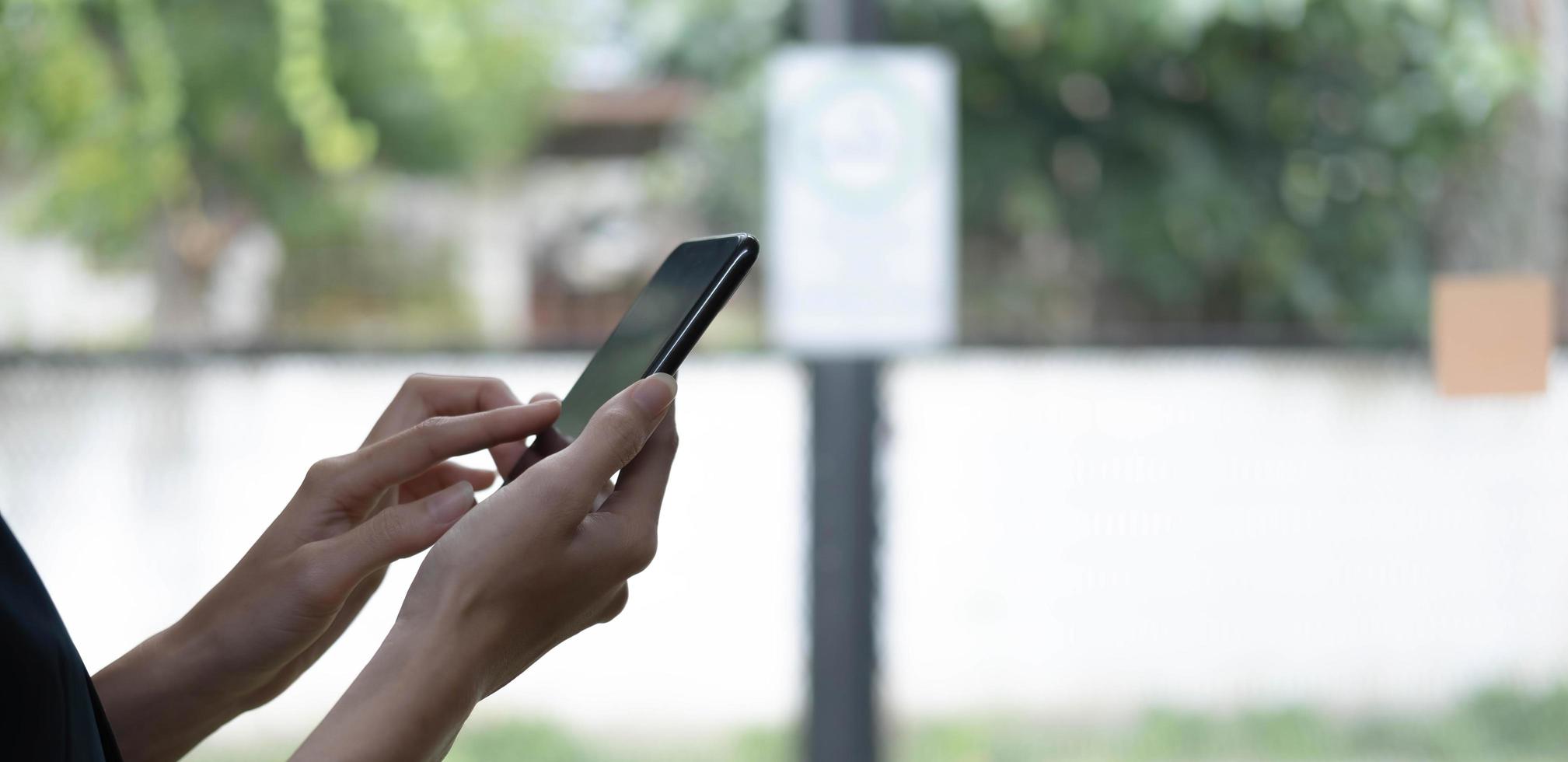 Close up woman holding smartphone, typing message, texting, chatting, female hands using cellphone, browsing mobile apps, internet, checking social networks, email, playing games on phone photo