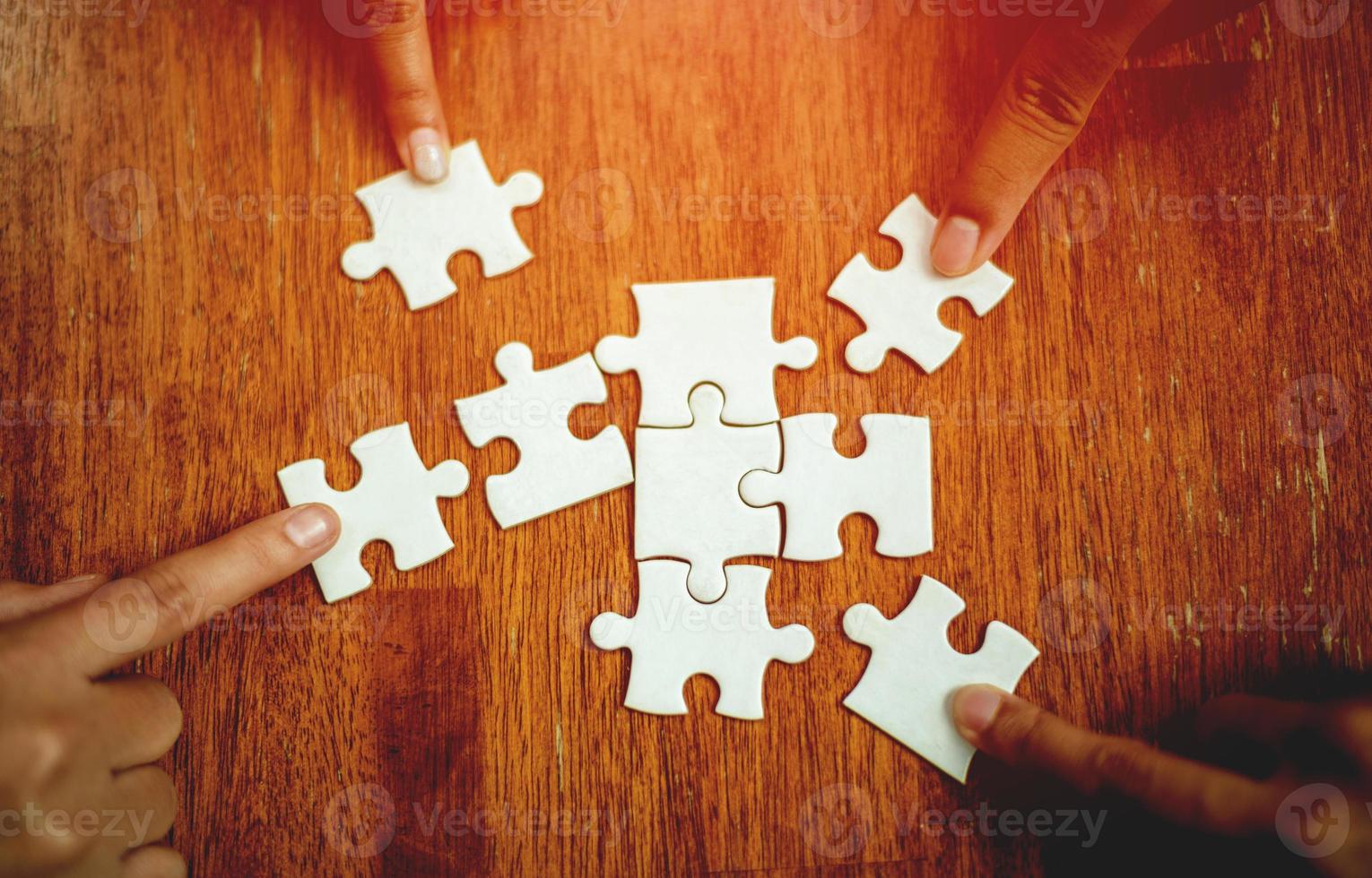teamwork unity and cooperation concept hand holding jigsaw close-up piece of hand that connect puzzle connected to each other business solution Success Concepts and Strategies photo