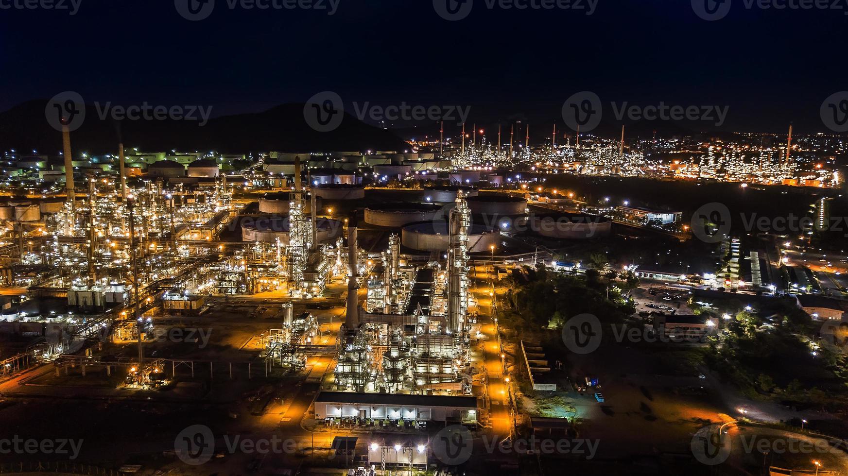 Oil refinery industry at night photo