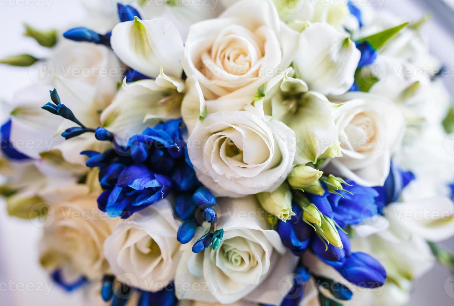 Beautiful wedding bridal bouquet of blue and white roses photo