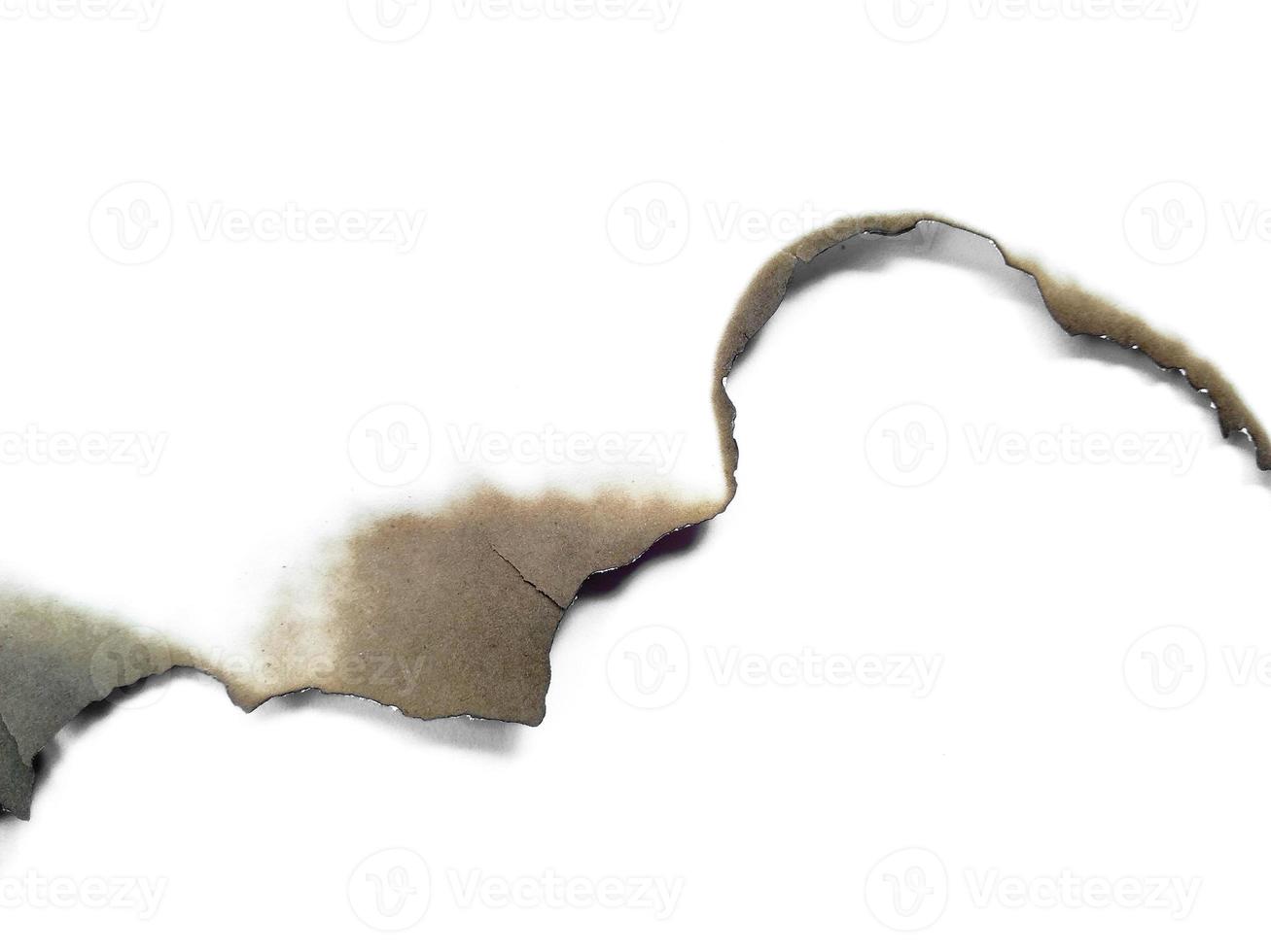 Paper burns on white backgrounds photo