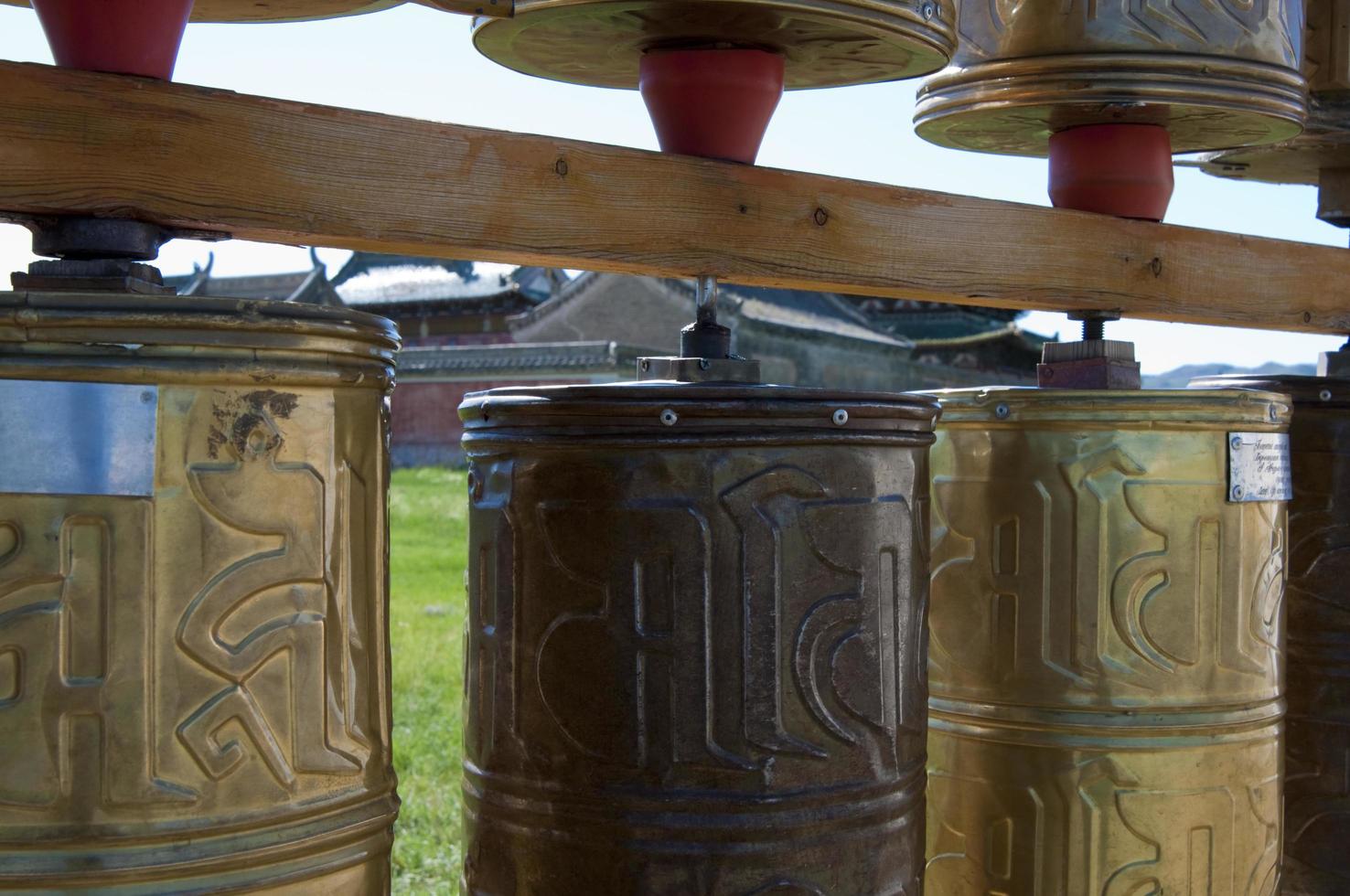 Close up of metal praying cylinders in the buddhist temple of Karakorum. Mongolia photo