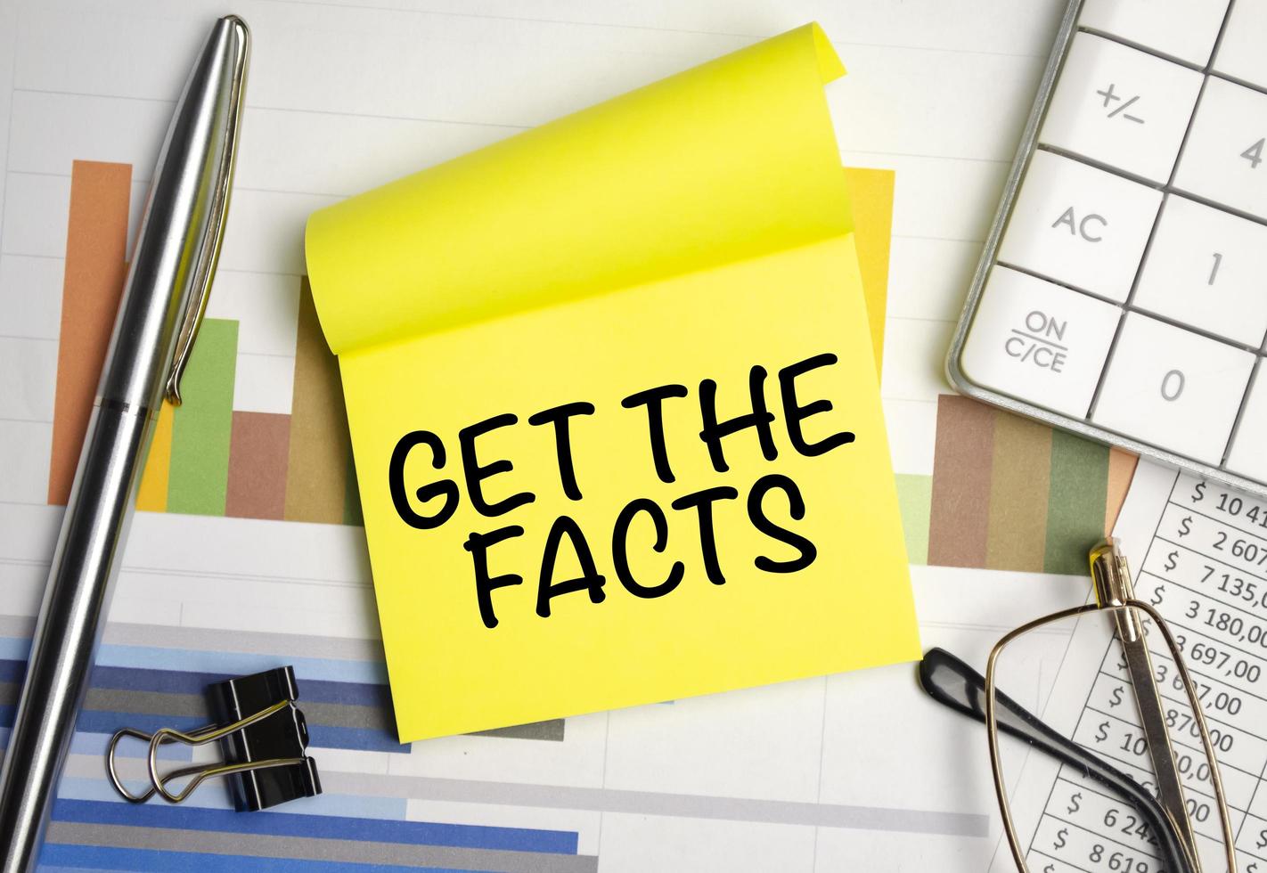 yellow sticker with the text Get the facts and charts photo