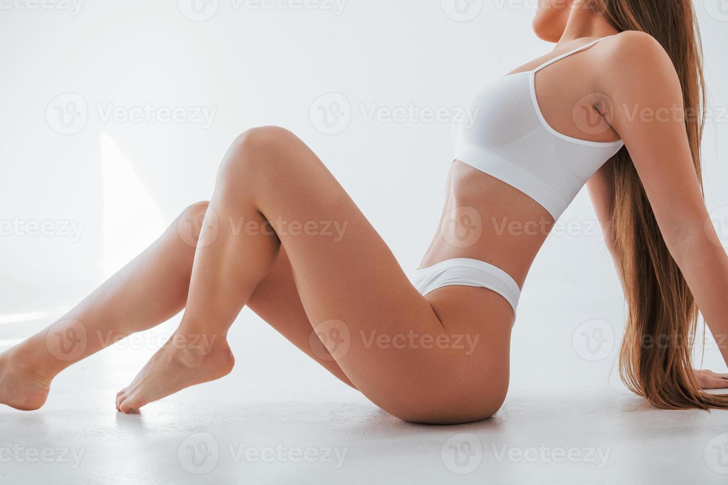 Close up side view. Woman in underwear with slim body type is posing in the  studio 9264384 Stock Photo at Vecteezy