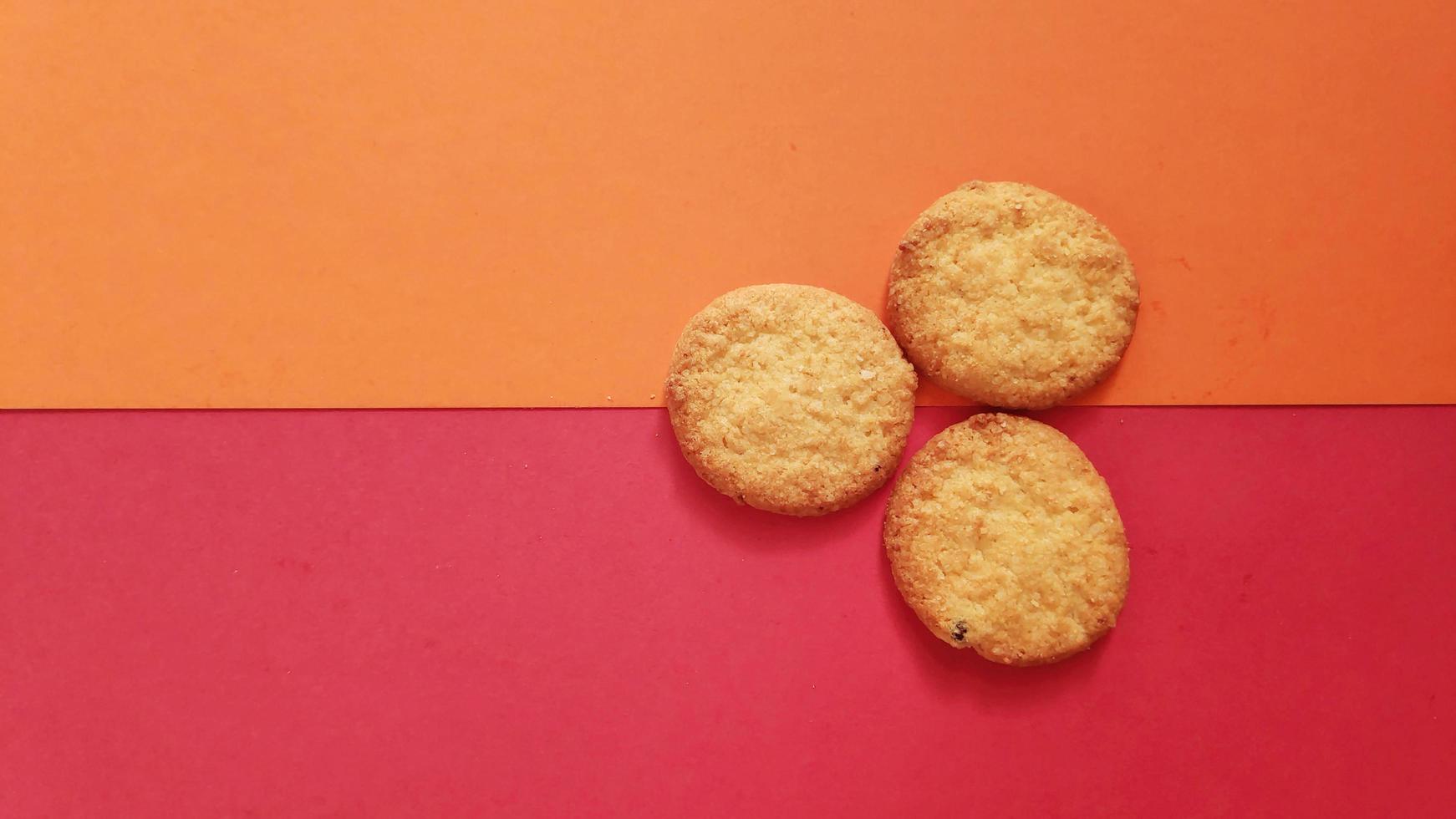 shapes of cookies in stack on red background photo