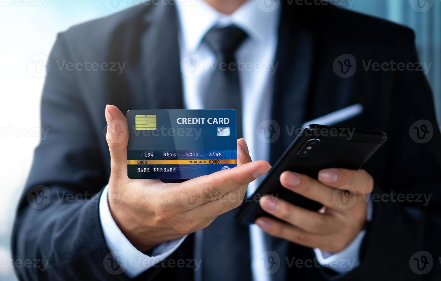 Businessman pay or shopping by credit card with smartphone photo