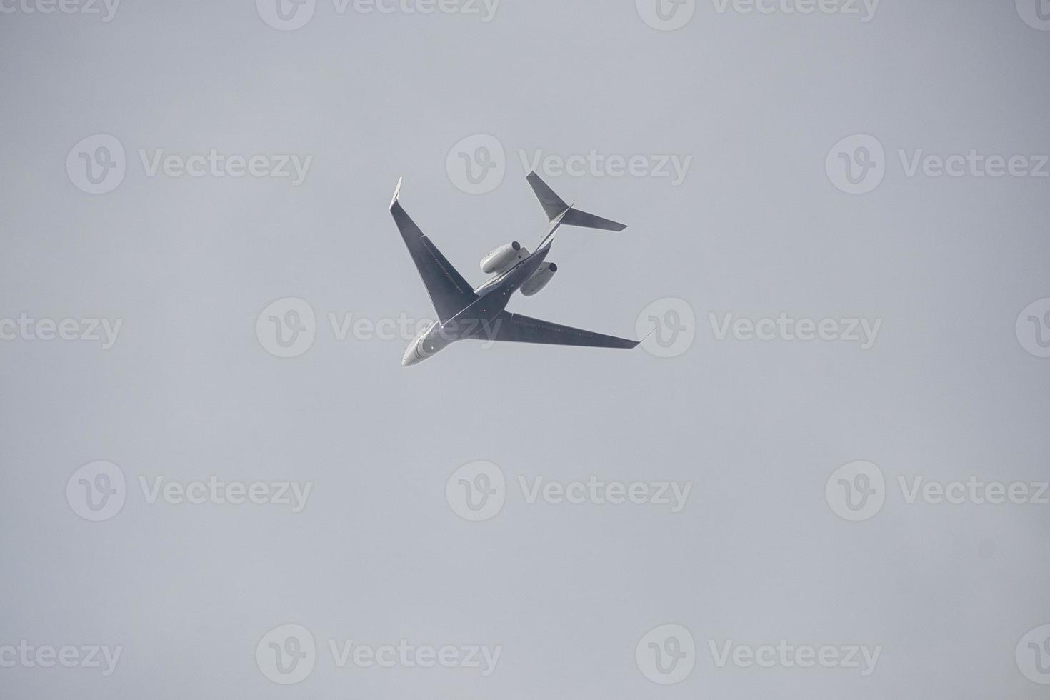 plane in the blue sky to the vacation destination photo