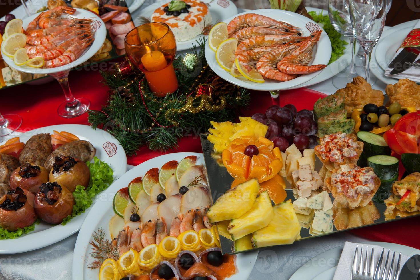 Beautiful festive table served for wedding celebration dinner at home or restaurant interior. Table full of food at a restaurant. Full round table. photo