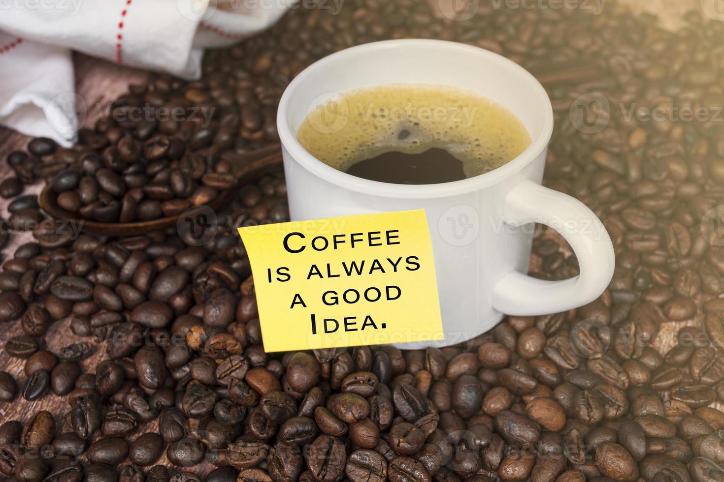 Motivational quote with coffee on wood background. Coffee is always a good idea. photo