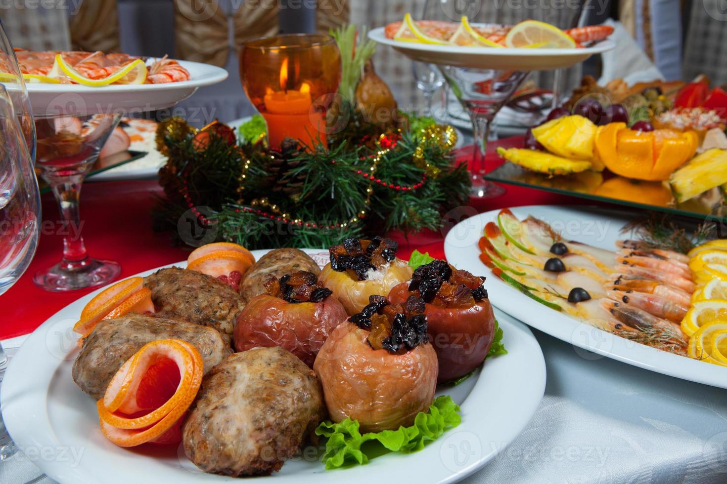 Beautiful festive table served for wedding celebration dinner at home or restaurant interior. Table full of food at a restaurant. Full round table. photo