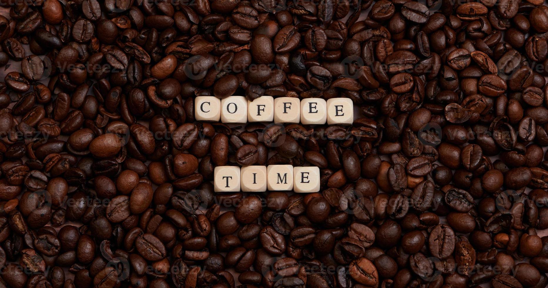 the word coffee time in the center of a lot of coffee beans photo