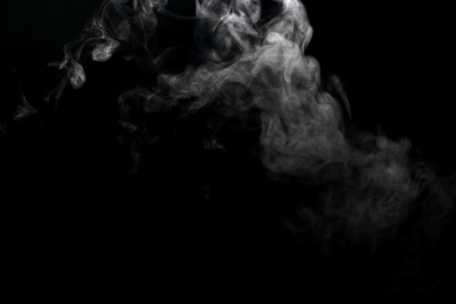 Abstract powder or smoke effect isolated on black background photo