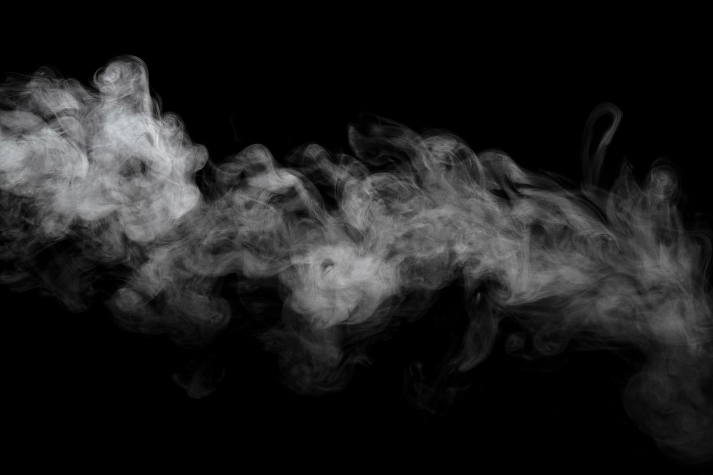 Abstract powder or smoke effect isolated on black background photo