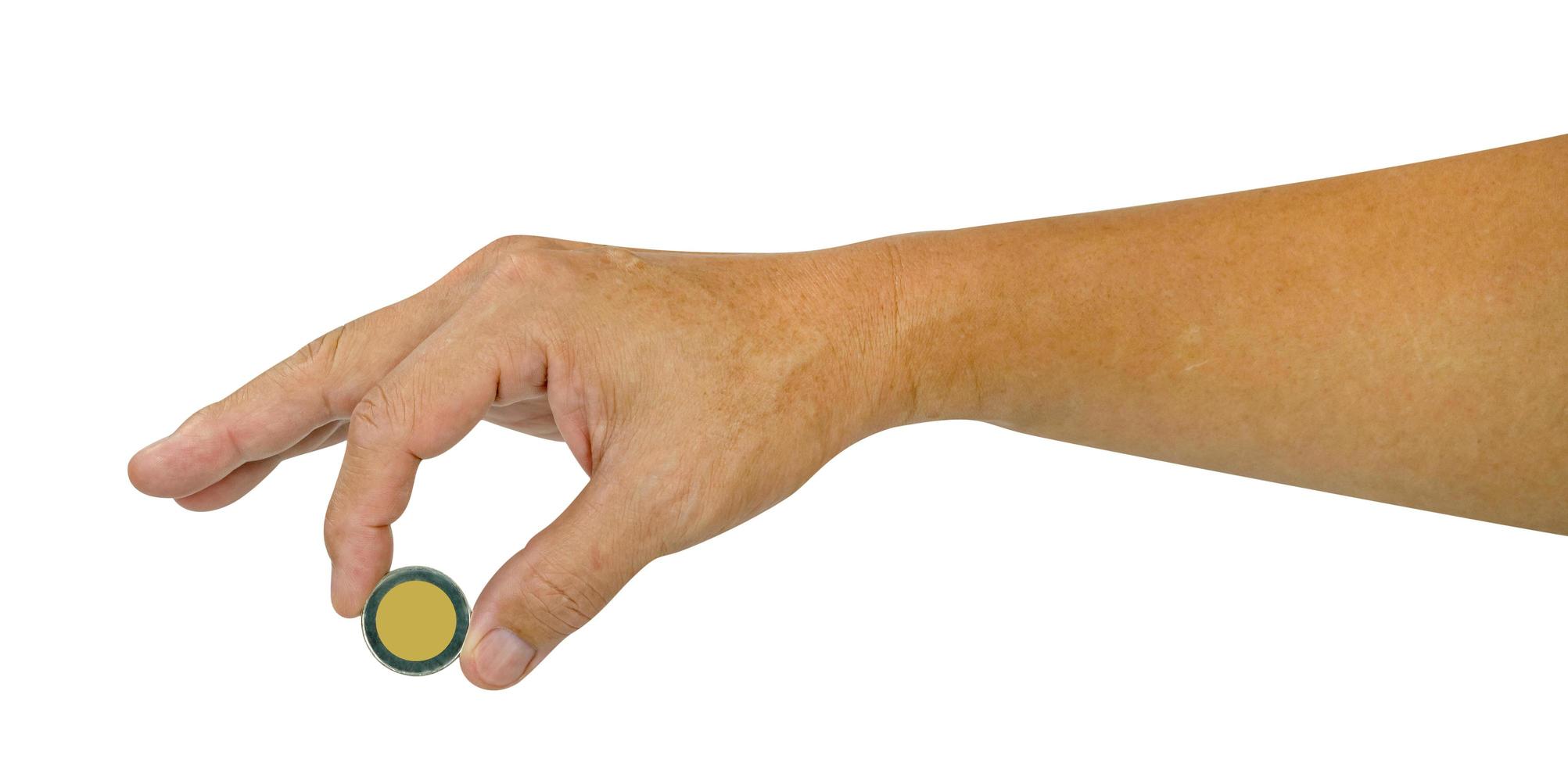 male hand holding coin,saving money of business concept,isolated on white background,include clipping path photo