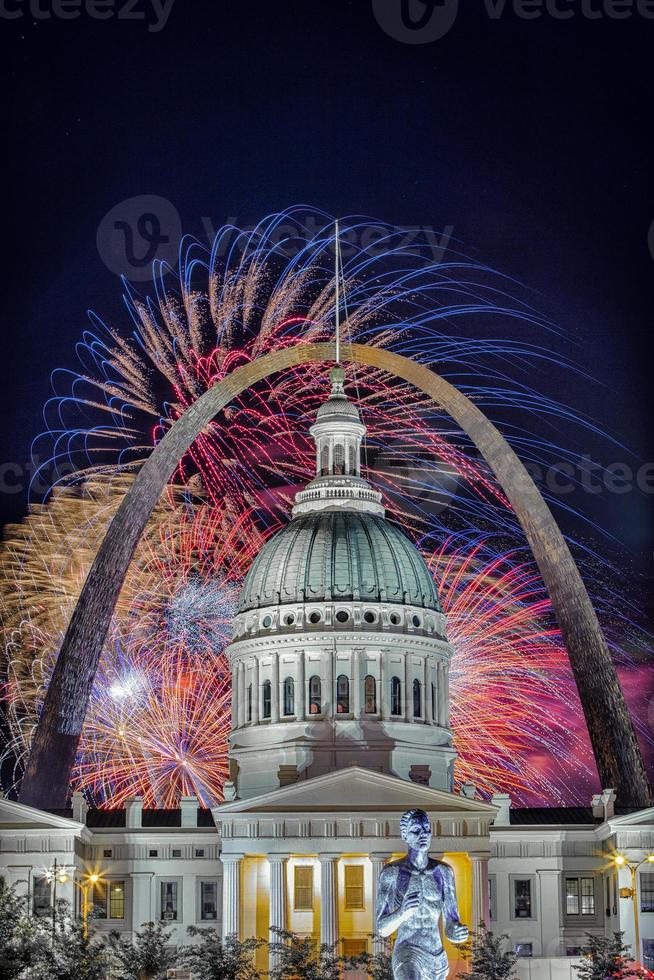 Independence Day Celebration Fireworks over Famous Gateway Arch of Saint Louis, with Court House Building  in the foreground, St Louis, Missouri, USA photo