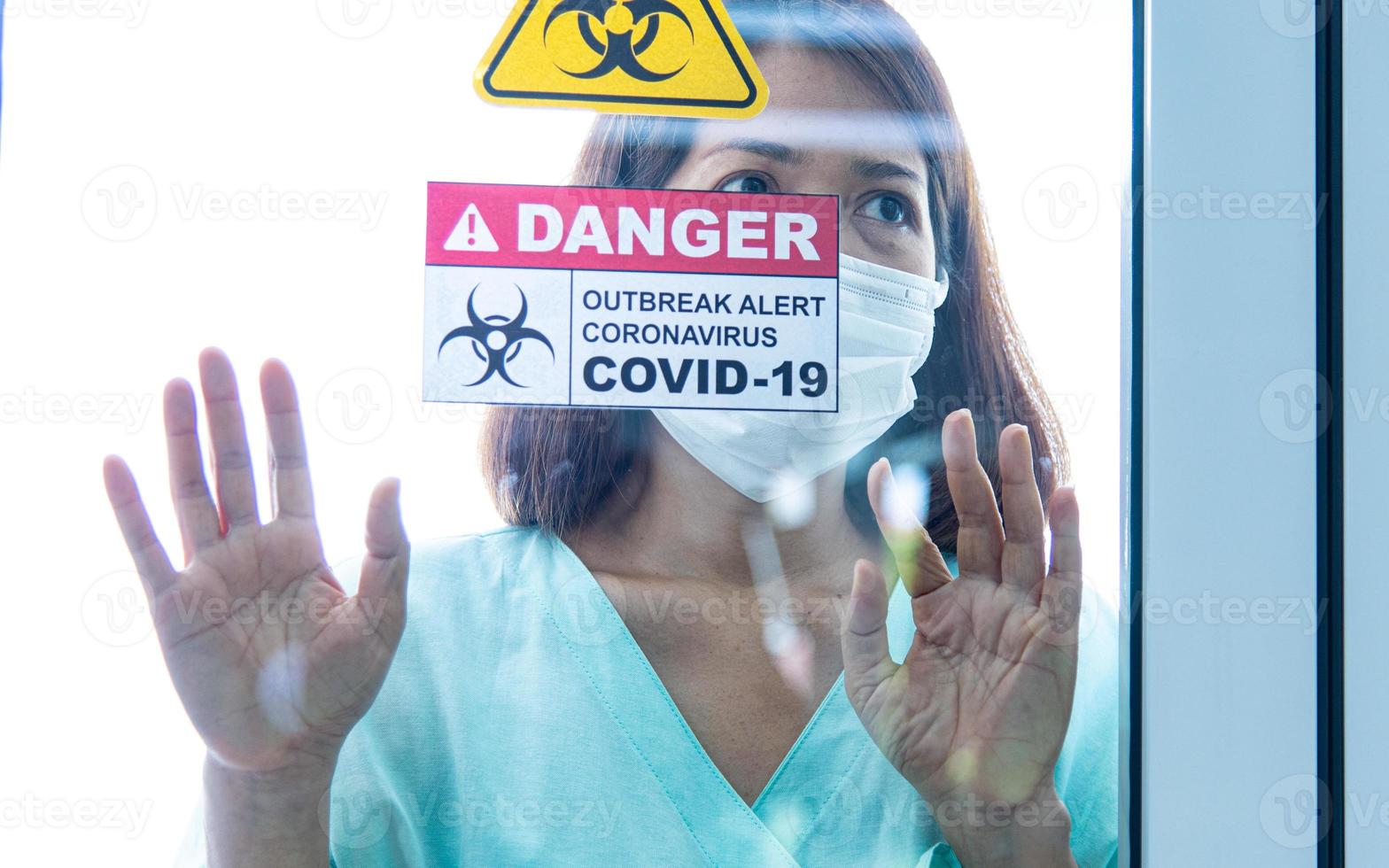 COVID-19, Corona Virus outbreak, quarantine and epidemic spread concept. Asian depressed CORONA or COVID-19 patient infection wear face mask in quarantine room at the hospital photo