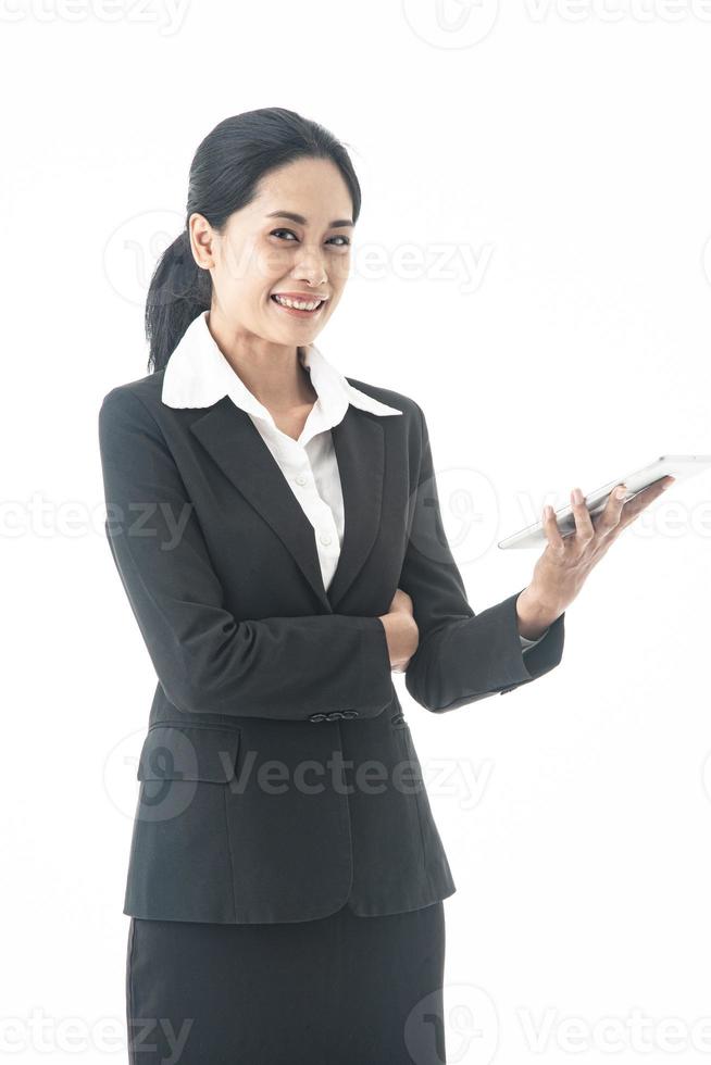 Asian beautiful smart  and young businesswoman is the executive or manager stand up thinking and smiling with confidence and surprise  in successful on isolated white background photo