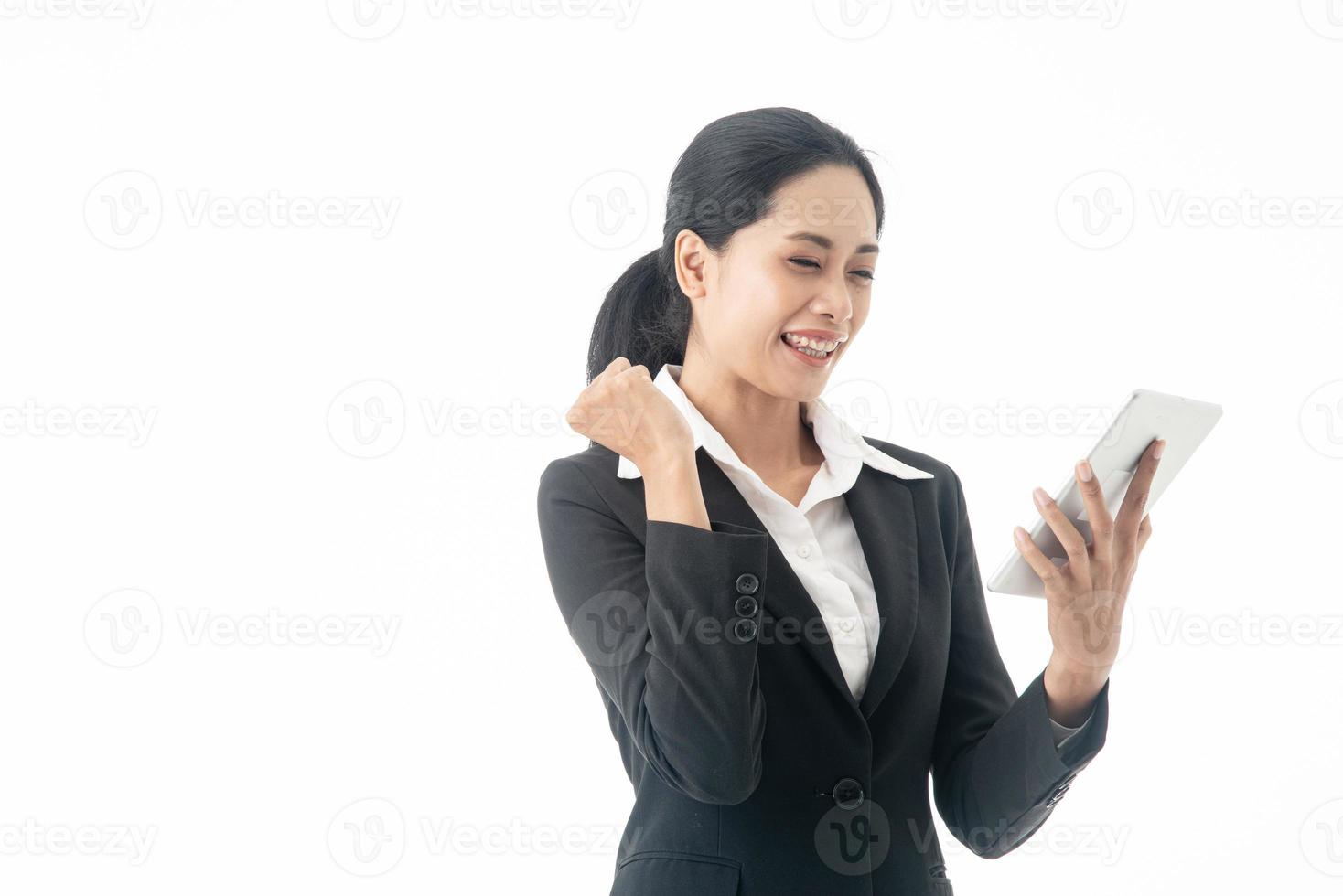 Asian beautiful smart  and young businesswoman is the executive or manager stand up thinking and smiling with confidence and surprise  in successful on isolated white background photo
