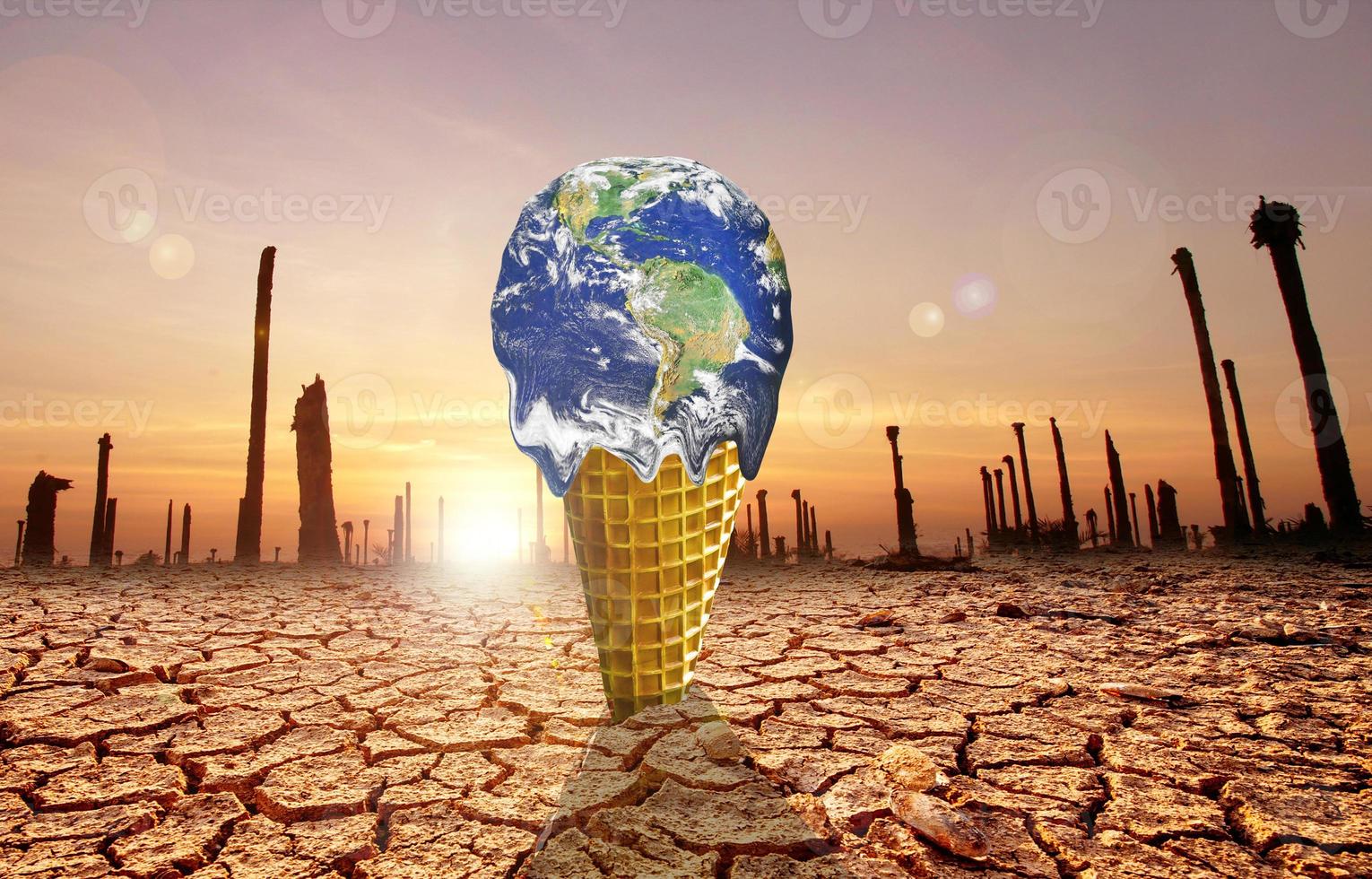 The concept of global warming and environmental change. Melting world on ice cream cone photo