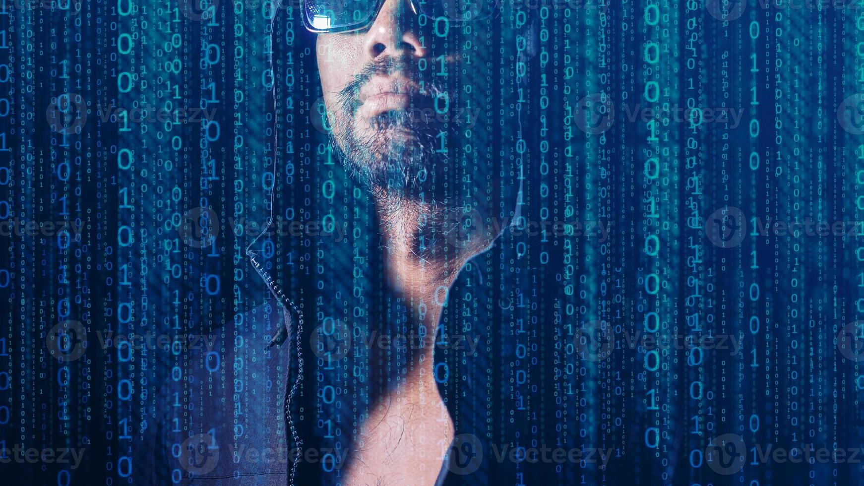 The concept of hackers and insecurity in networking. Dishonest hood man or data thieves photo