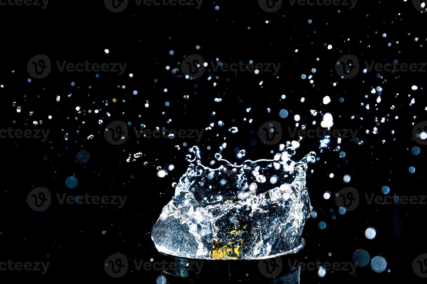 Abstract background of Water splashing on a black background. idea for freshness photo