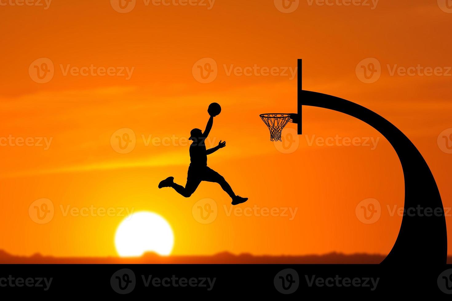 basketball player silhouette jumping photo