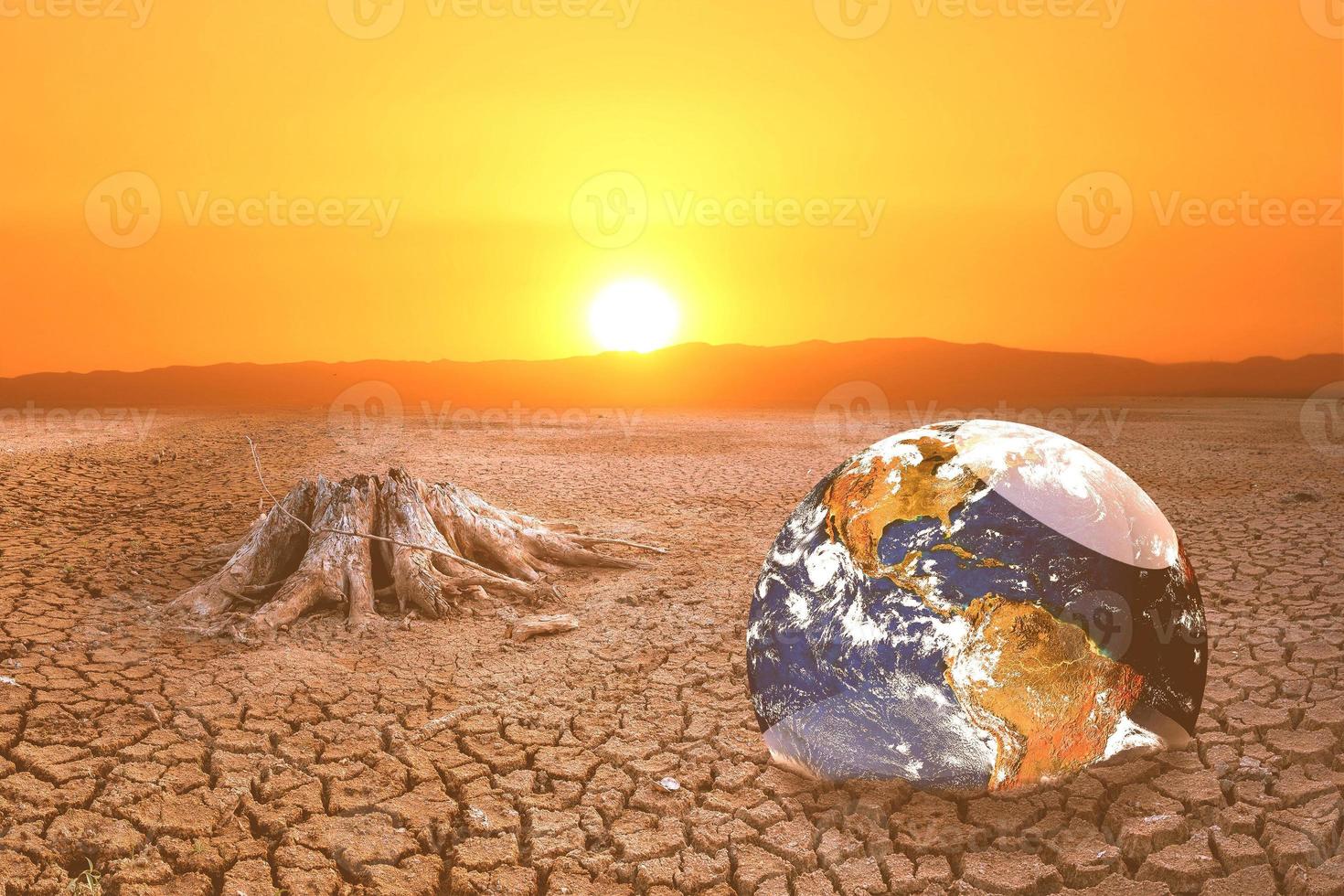 The concept of global warming and drought and poverty and food shortages. Arid soils with hot climates have a globe that lacks green space. photo