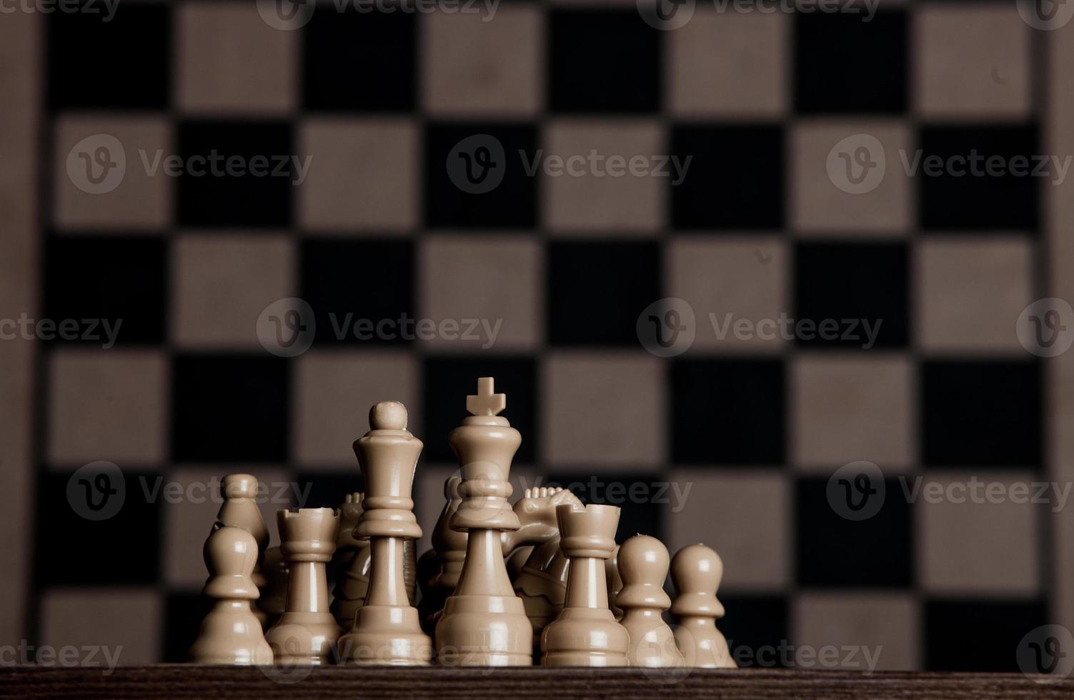 Chess board with chess pieces. Chess on the dark background. Business success concept. Strategy. Checkmate. photo