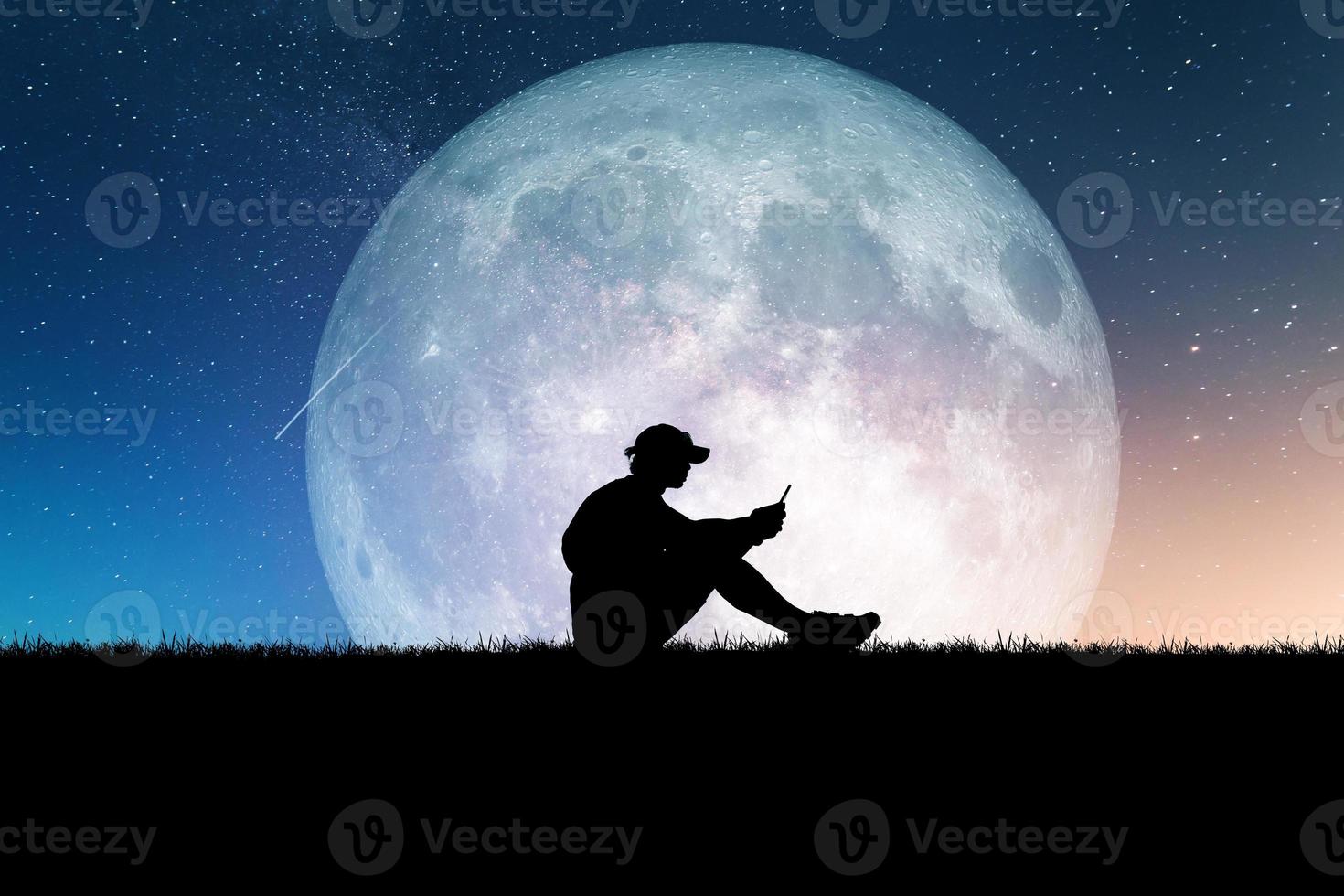 Concept of loneliness and disappointment in love. Sad man sitting element of the picture is decorated by NASA photo