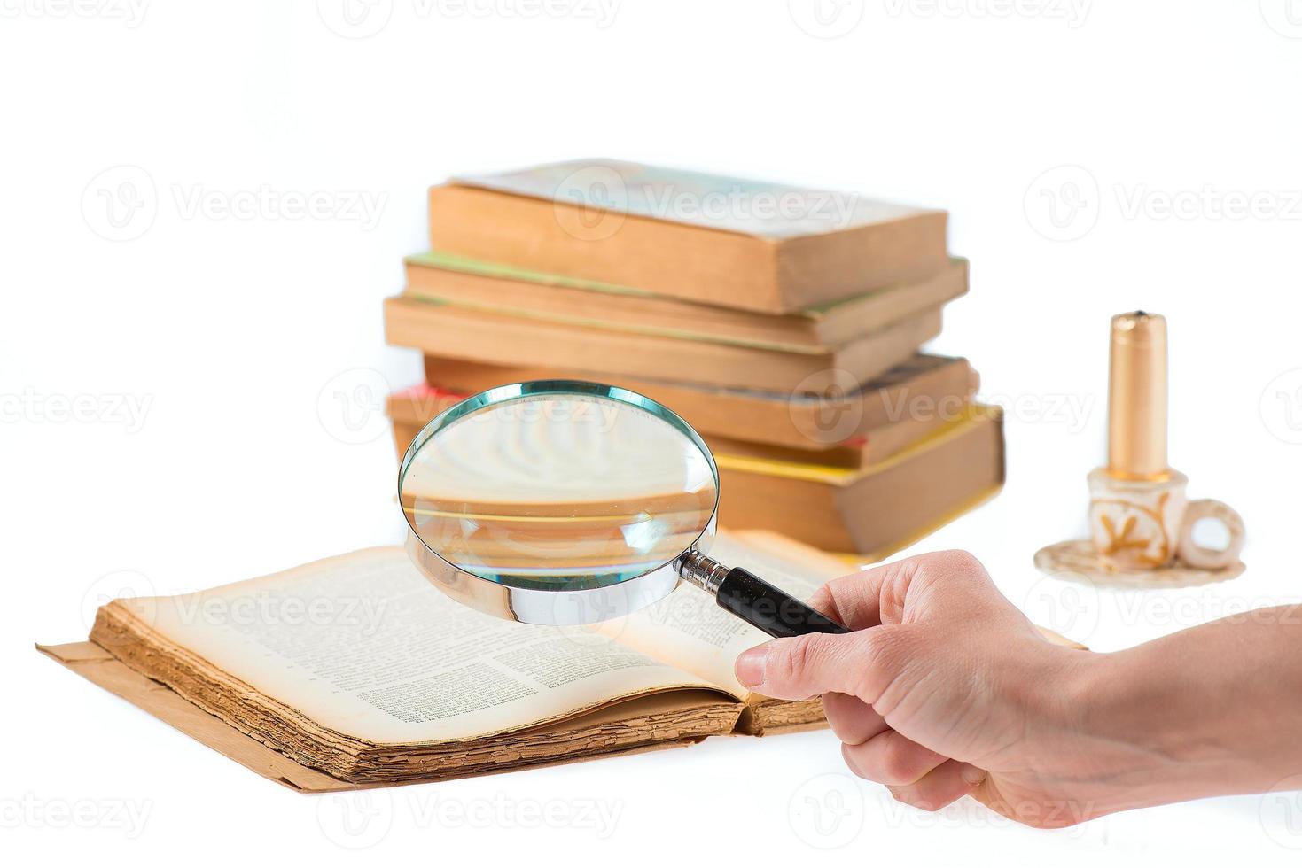 Magnifier search of old books photo