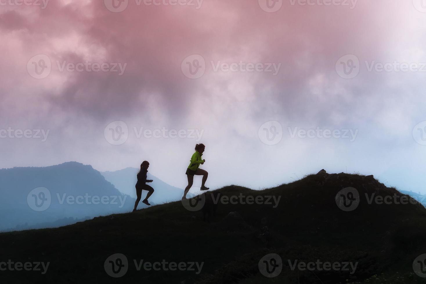 Mountain racing training of two girls photo