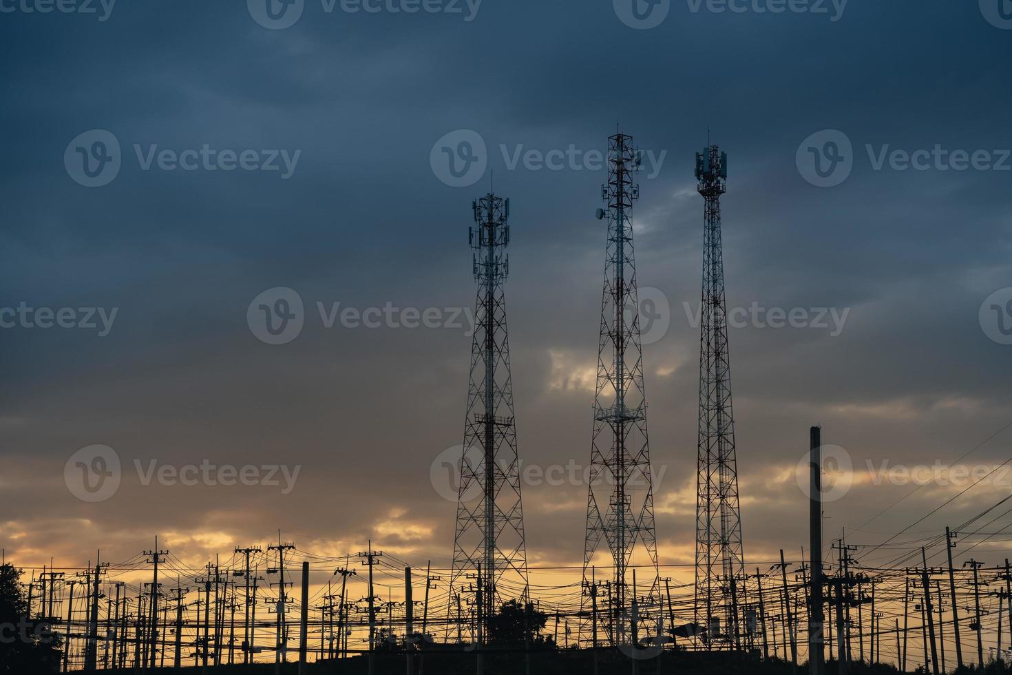high voltage post.High voltage tower at power plant sunset evening golden time  sky background photo