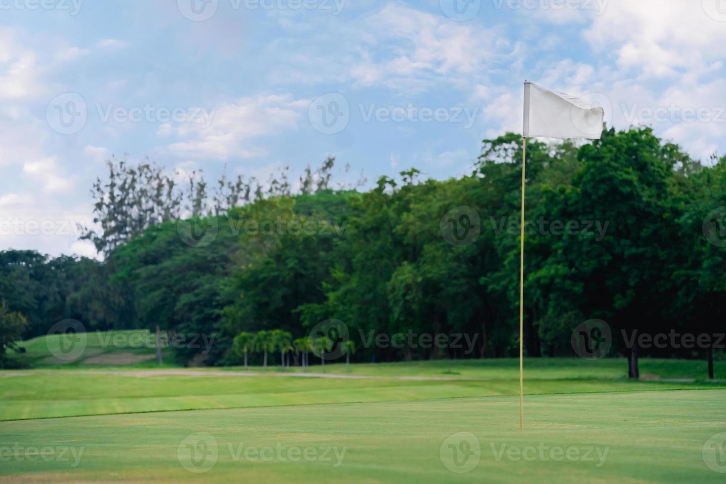 Golf course at the country side. Sand bunkers at the beautiful at sunset, sunrise time.Beautiful view landscape in evening time green grass at golf course. photo