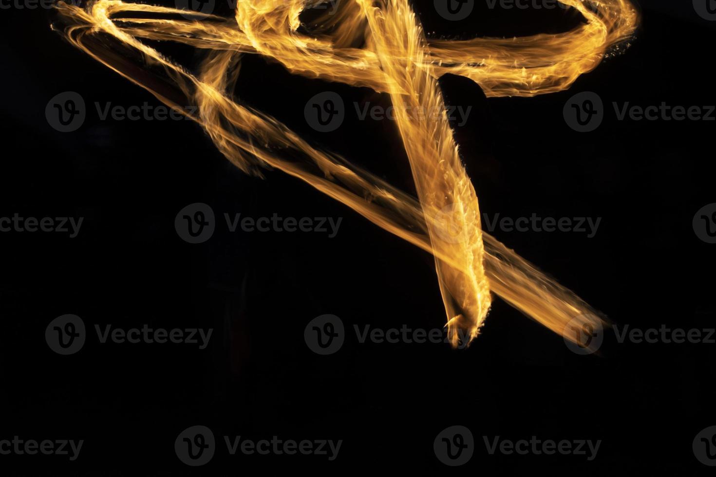 Flames in dark. Fire on black background. Details of ignition. photo