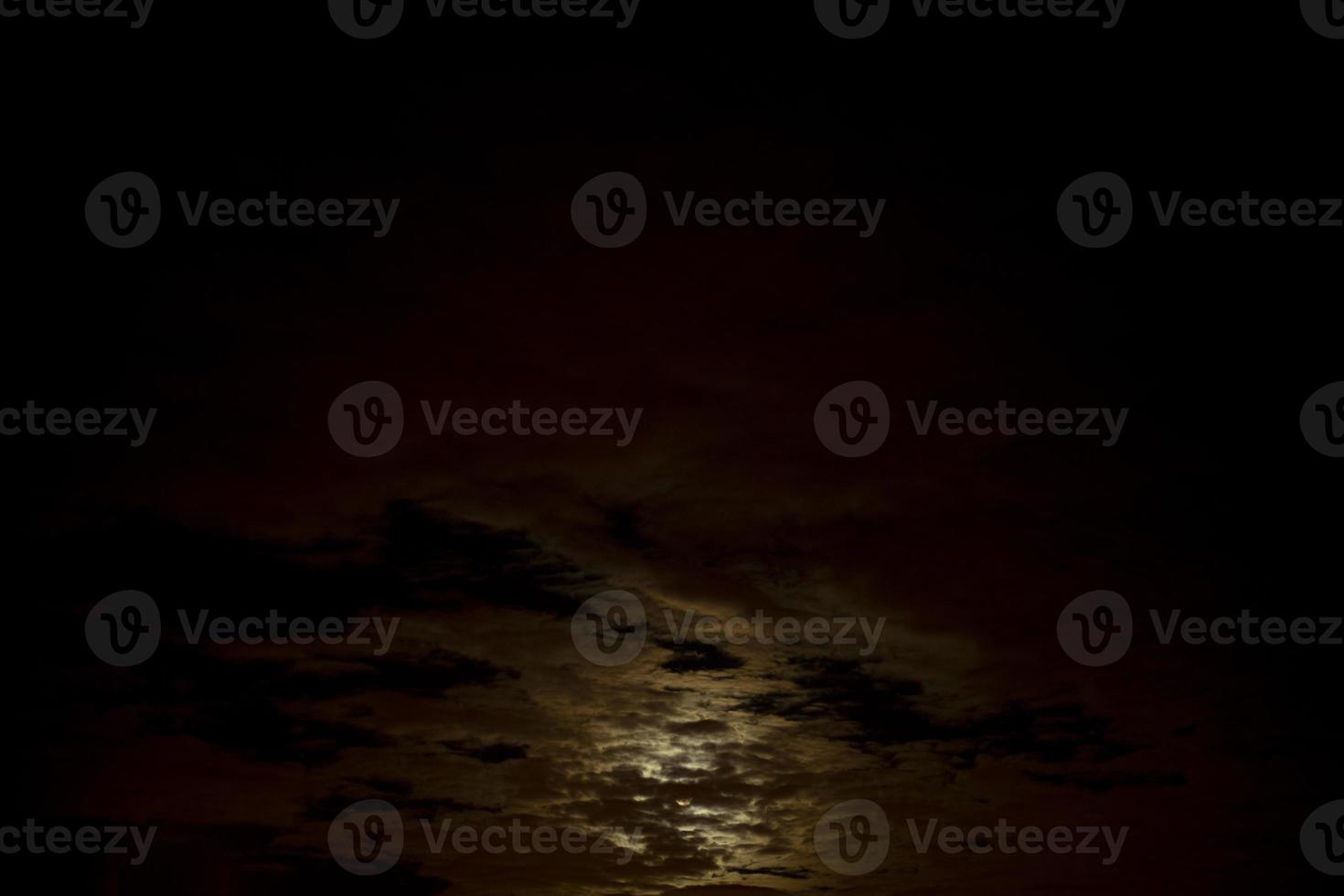 Clouds in light of moon. Sky at night. photo