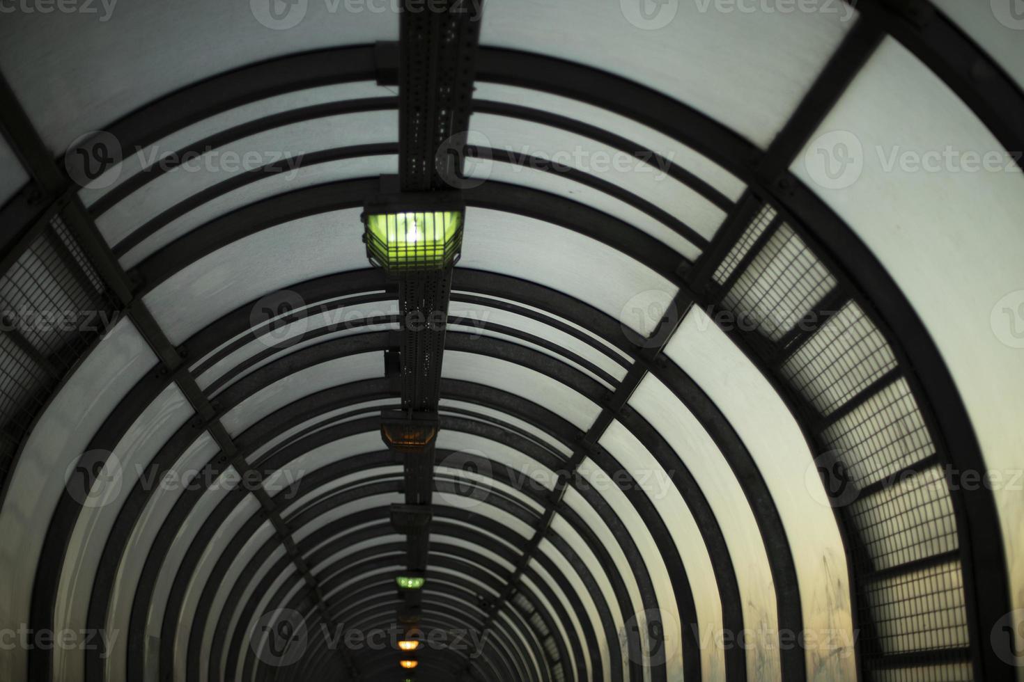 Tunnel in evening. Lamps in pedestrian crossing. Architecture details. photo